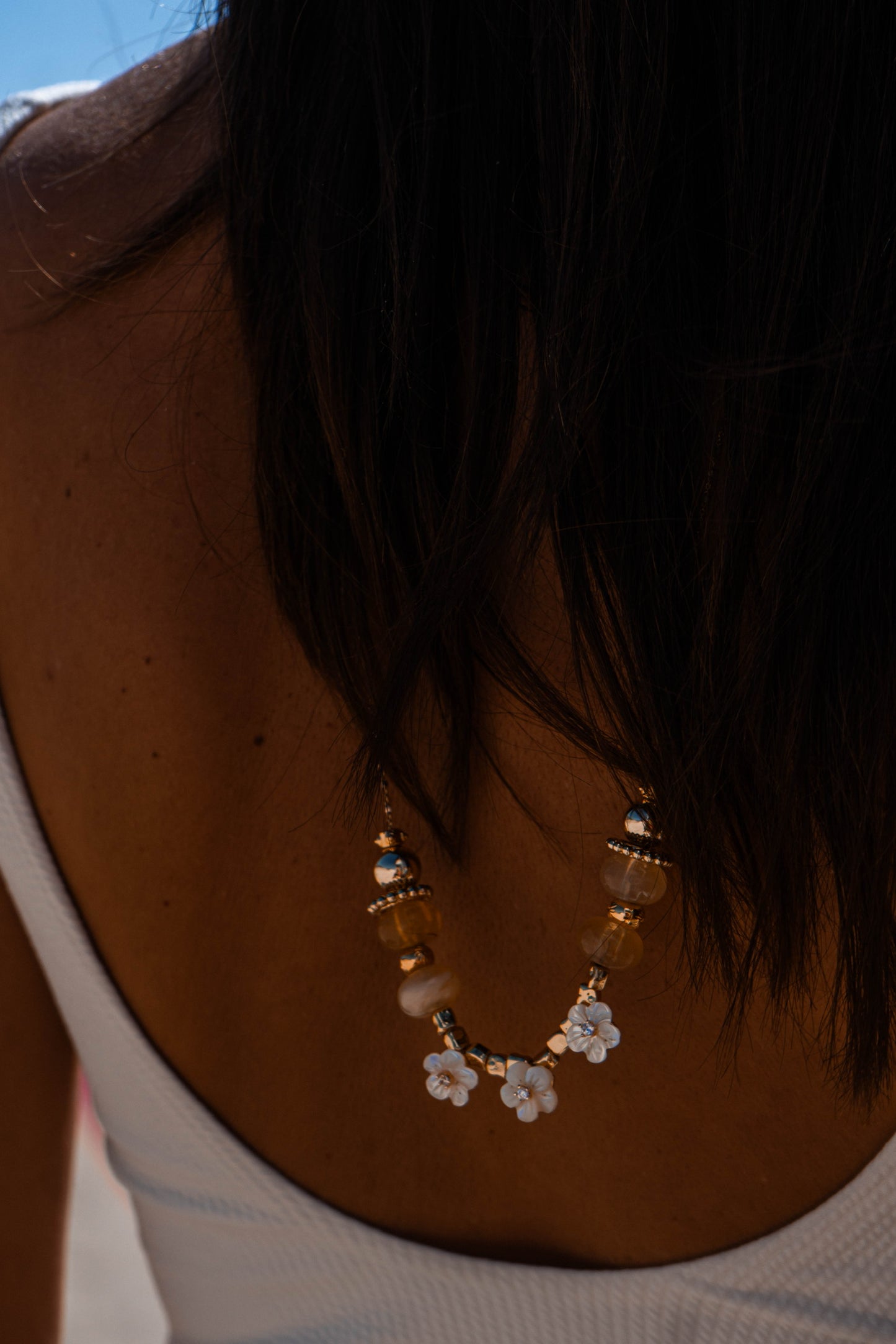 IVORY BLOOM LONG CHARMS NECKLACE WITH FLOWERS